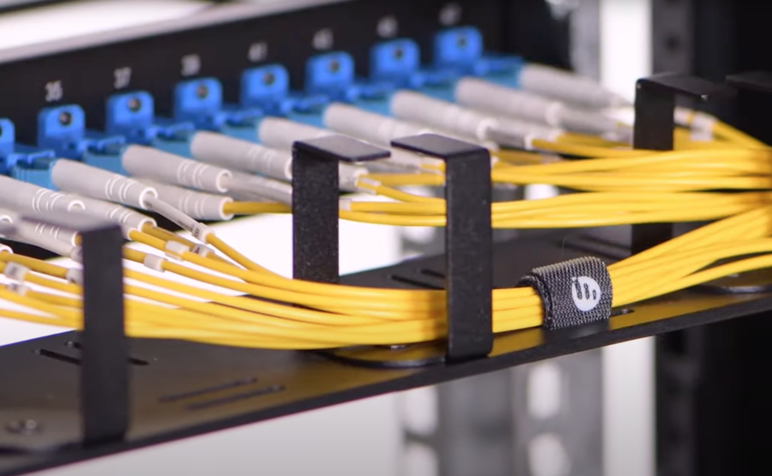 Patching fibres from patch panels to equipment